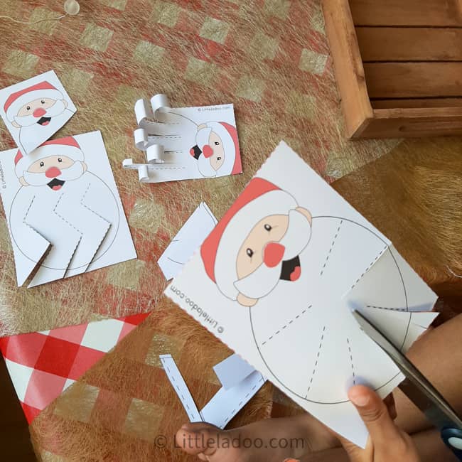 child cutting santa's beard scissor skills cards