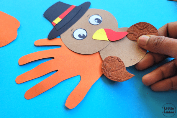 Add wings to the paper turkey