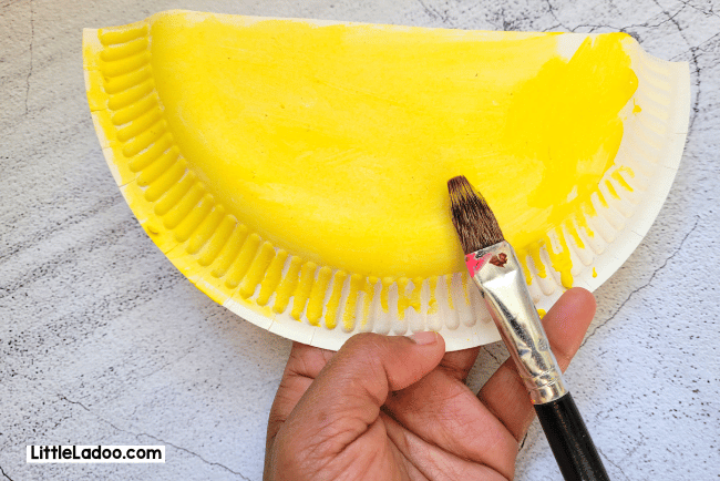 Paint the paper plate yellow for chick craft