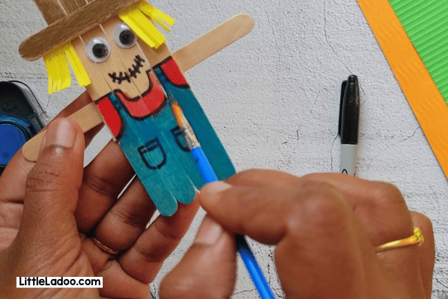 Painting the Popsicle Stick Scarecrow