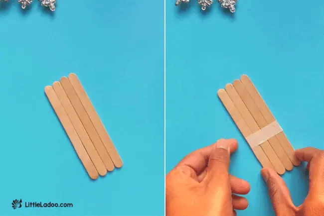 Arranging 4 popsicle sticks for winter craft