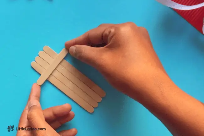 Sticking small popsicle stick 