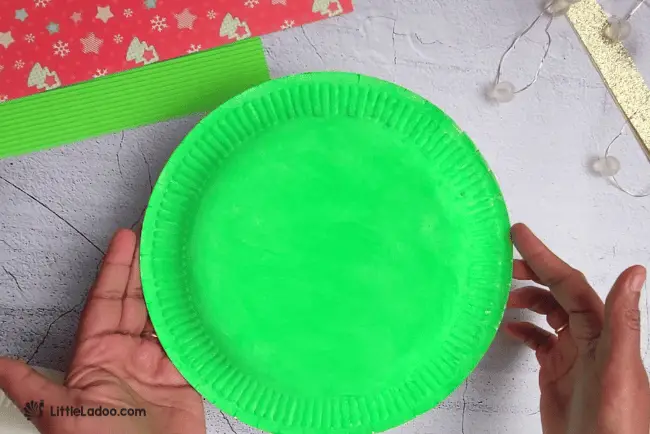 Paint the paper plate green